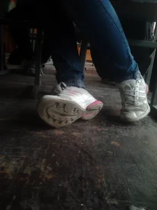 Candid Teen College Girl's Legs in Tight Jeans And Feet in Sneakers Under Desk Creepshot in Class