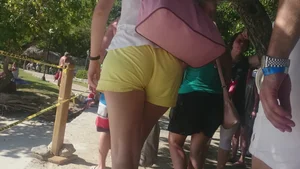 Milf in yellow shorts with vpl and a wedgie
