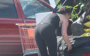 Redhead milf with a nice ass and vtl in leggings while loading her car