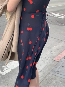 Business women with a visible thong in a see through Cherry Dress