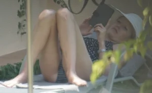 Skinny girl laying out in her bikini has pussy lip slip