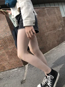 Cute candid teen with pale slim legs in shorts