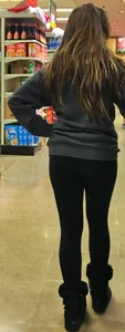 Fit shopping brunette girl in leggings and a hoodie with a nice ass