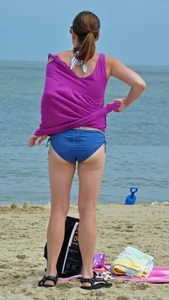 Blue bikini beach girl undressing with a decent ass