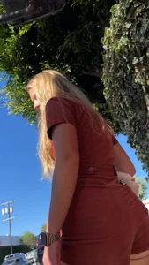 Summer blond in orange showing cheeks