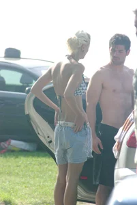 Blonde babe changing into and out of bikini and shows her tits