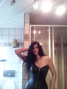Girl in a Leather Corset, Selfie in Bathroom