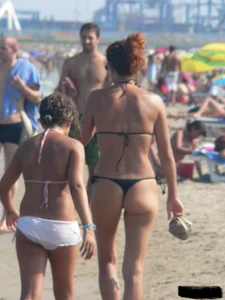 Bunch of sexy babes at the beach in thong bikinis