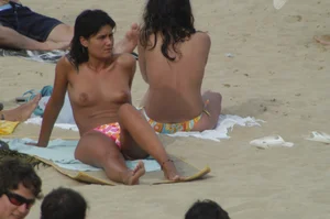 Topless girls on a beach in Barcelona