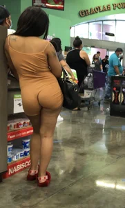 Latina with hard nipples and a big booty in tight spandex shorts outfit