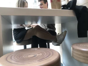 Girl in a Skirt and Pantyhose Touching Herself Under a Table at a Restaurant Creepshots Collection