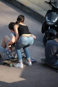 Hot brunette skateboarder in tight jeans and with hard nipples