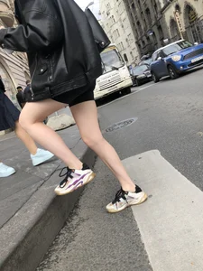 Very hot legs of a candid girl wearing a leather jacket