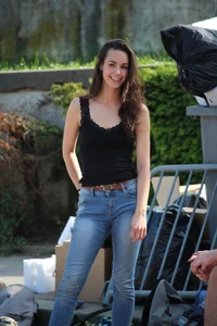 Hot brunette skateboarder in tight jeans and with hard nipples
