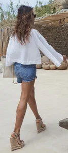 Flat ass leggy girl in denim shorts