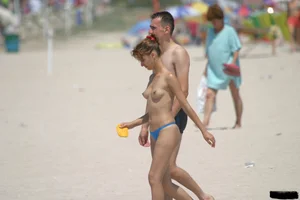 A bunch of sexy beach voyeur babes in bikinis, thongs and topless