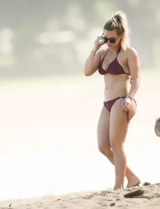 Hilary Duff in maroon bikini on the beach with a big booty