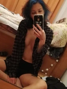 Hot Girl in an Unbuttoned Shirt With No Bra On Sitting With Crossed Legs on the Floor in Her Bedroom in Panties Home Mirror Selfie