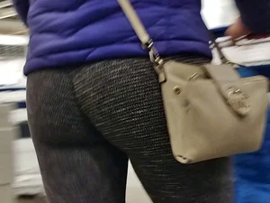Blonde lady shopping in tight dark grey leggings