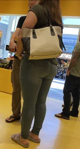 Thick brunette filling out jeans at Lego Store