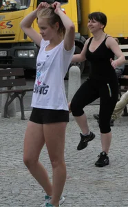 Girl Working Out on the City Street Candid Photos