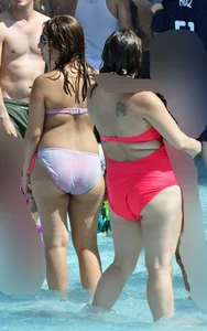 Two thick milfs at the pool in bikinis