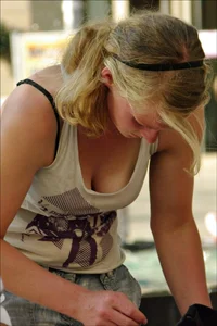 Blonde babe with nice tits showing some cleavage