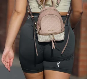Blonde woman in lycra shorts - good front view, back view ruined by a bag