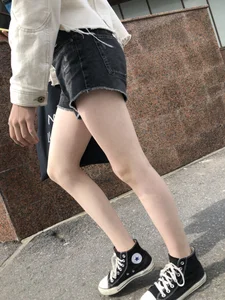Cute candid teen with pale slim legs in shorts