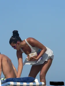 Hot ass topless beach girl with great tits lets her little brother oil up her ass in thong bikini