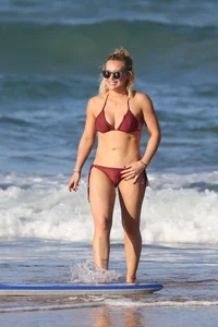 Hilary Duff in maroon bikini on the beach with a big booty