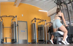 Gym brunette in tight grey shorts