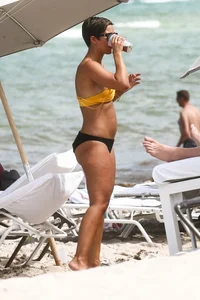 Frankie Bridge nip slips in a bikini on the beach