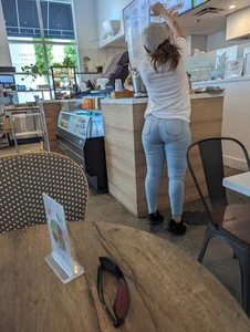 Tiny Latina waitress in tight jeans with cake