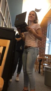 Very cute teen candid girl wearing tight jeans with a phone in back pocket