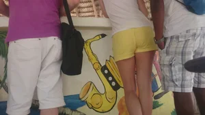 Milf in yellow shorts with vpl and a wedgie