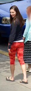 Beautiful brunette teen in orange patterned leggings