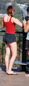 Redhead beauty in short shorts showing some cheeks and panties