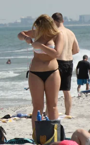 Big boobed thick blonde on the beach in a bikini