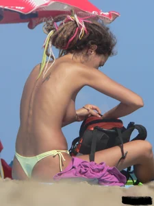 Sexy girls going topless at the beach showing off their sexy bodies
