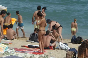 Topless girls on a beach in Barcelona