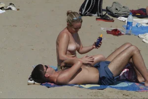 Girls on a nude beach in Sitges, Spain