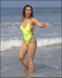 Sexy ass beach babe in a yellow thong swimsuit