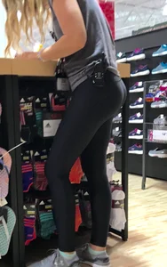 Shoe store employee with a sexy bubble butt in leggings