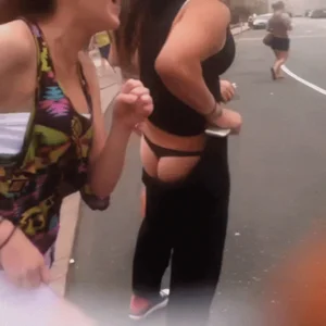 Teens fooling around on the street, pulling down pants