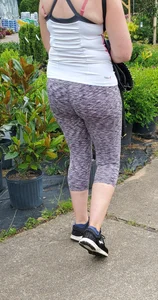 Milf booty in tight leggings shopping for plants