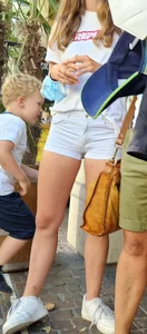 A Sexy Girl in Shorts And Sneakers Street Photos, Beautiful Legs
