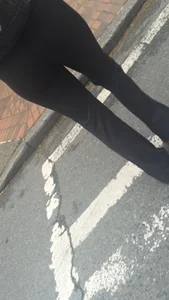 Girl with a nice ass in leggings walking down the street