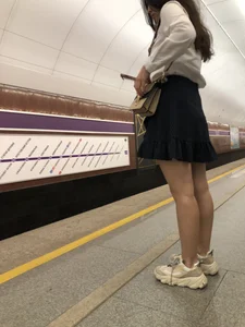 Girl in a Blouse And a Skirt With Great Legs Creepshots Gallery - Standing on the Subway Station, then Sitting With Crossed Legs in a Train