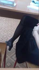 Candid College Girl’s Leg in a High Heeled Shoe Under Desk Photo